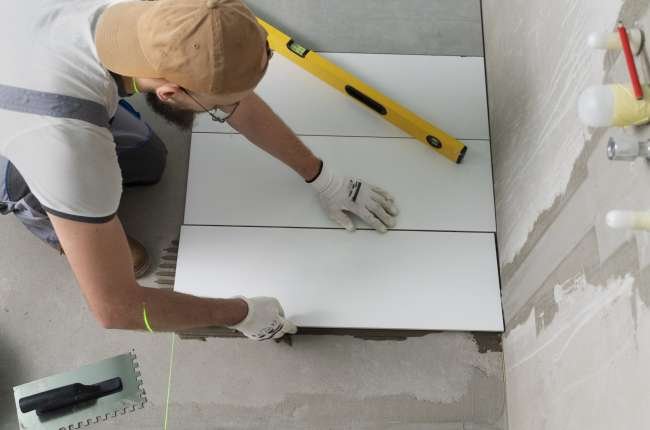 tiler-working-renovation-apartment tiler-working-renovation-apartment